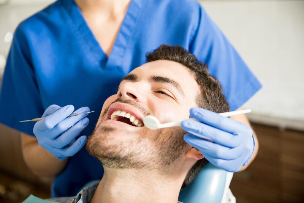 Mid Adult Patient Receiving Dental Treatment
